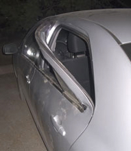 Car damaged by bear.